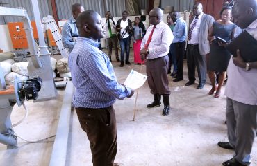 Hon. Minister Wilson Muruli Mukasa being taken around the Research center Projects at Nnamulonge Research cebtre on 24th November , 2019